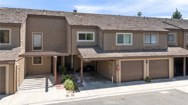 a front view of a house with yard