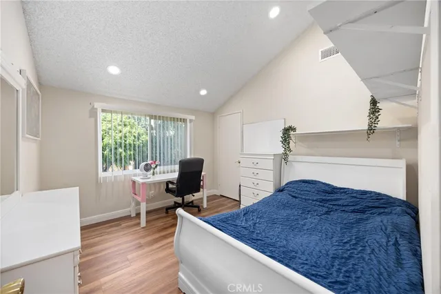 a workspace room with furniture wooden floor and windows