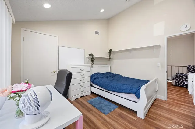 a bedroom with a bed and a table