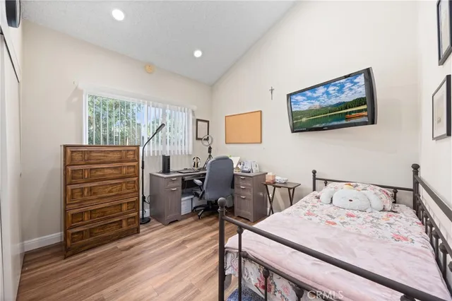 a bedroom with a bed and furniture