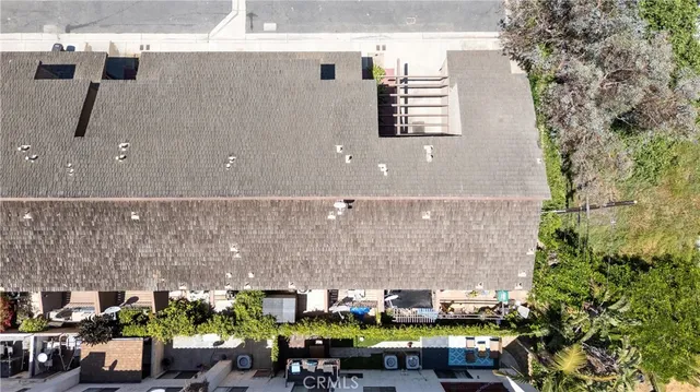 a storage room with a sink and wooden floor