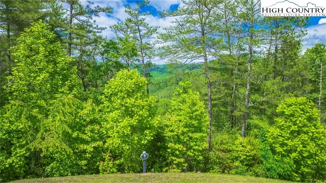 a view of sign board with yard