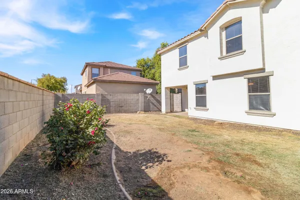 a view of a house with a backyard