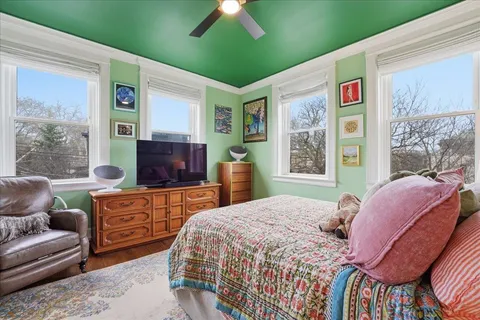 a bedroom with a bed and a couch