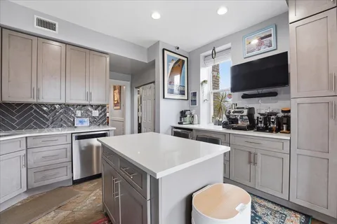 a kitchen with a sink stove and refrigerator