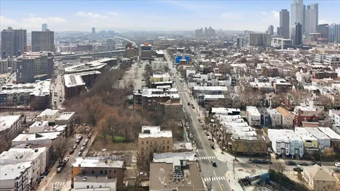 an aerial view of a city with lots of residential buildings