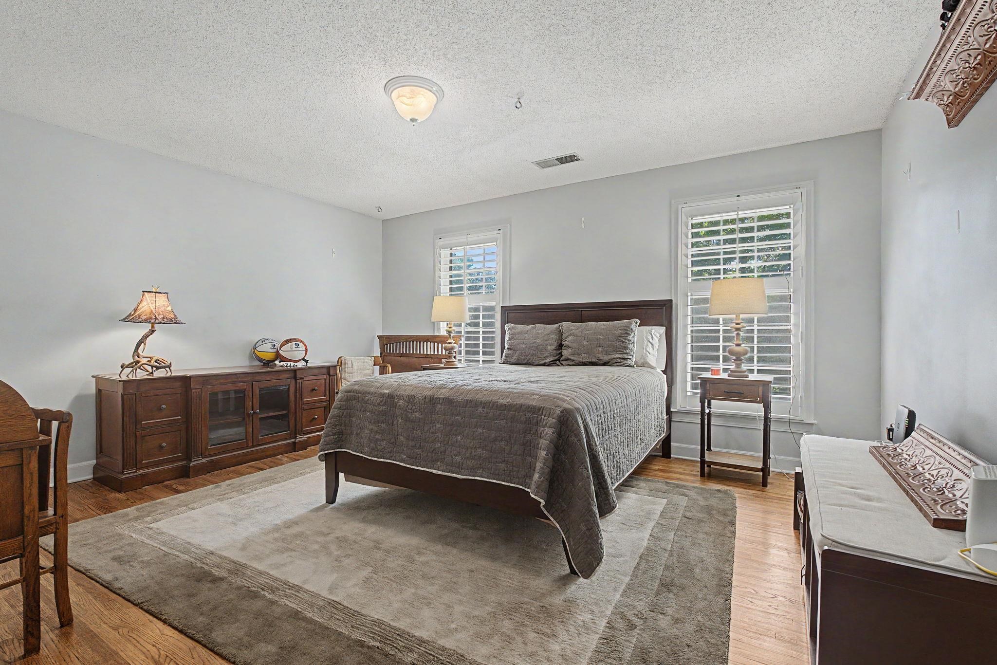 1929 Miller Farms Road Germantown, TN 38138 - Photo 25 of 40 Hardwood flooring extending throughout, complemented by light gray wall paint and white trim