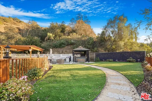 an aerial view of residential house with outdoor space