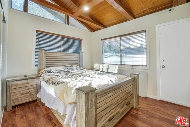 a bathroom with a shower a sink and a mirror
