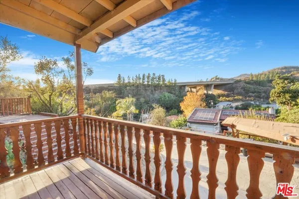a view of a balcony with an outdoor space
