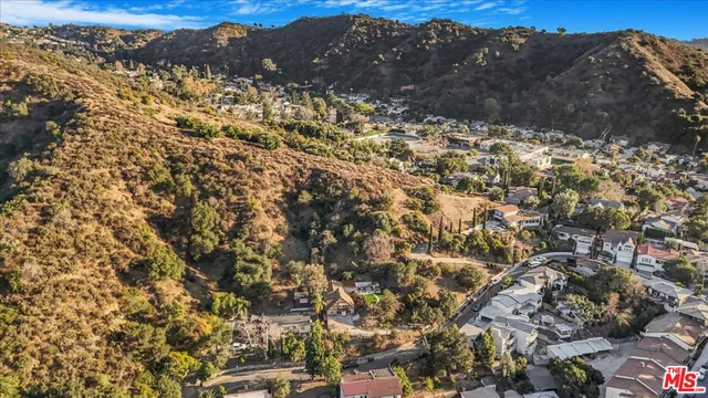 a view of a house with a big yard