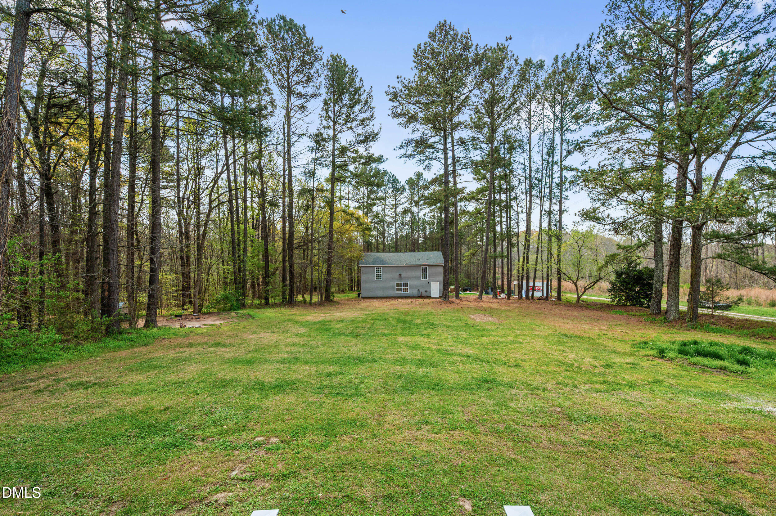 1957 Hilltop Road Raleigh, NC 27610 - Photo 35 of 46 a house with a trees in front of it