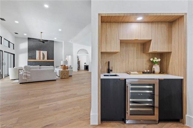 a kitchen with kitchen island cabinets and a sink