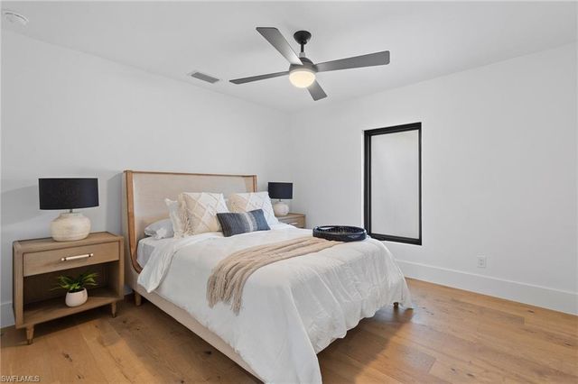 a bedroom with a bed and a tv