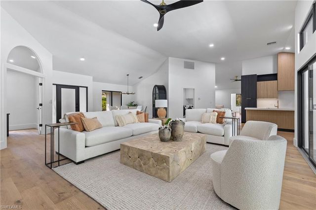 a living room with furniture white walls and white walls