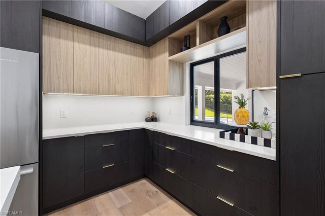 a kitchen with a sink and a window