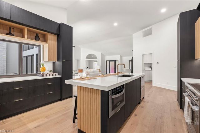 a kitchen with a stove and a sink