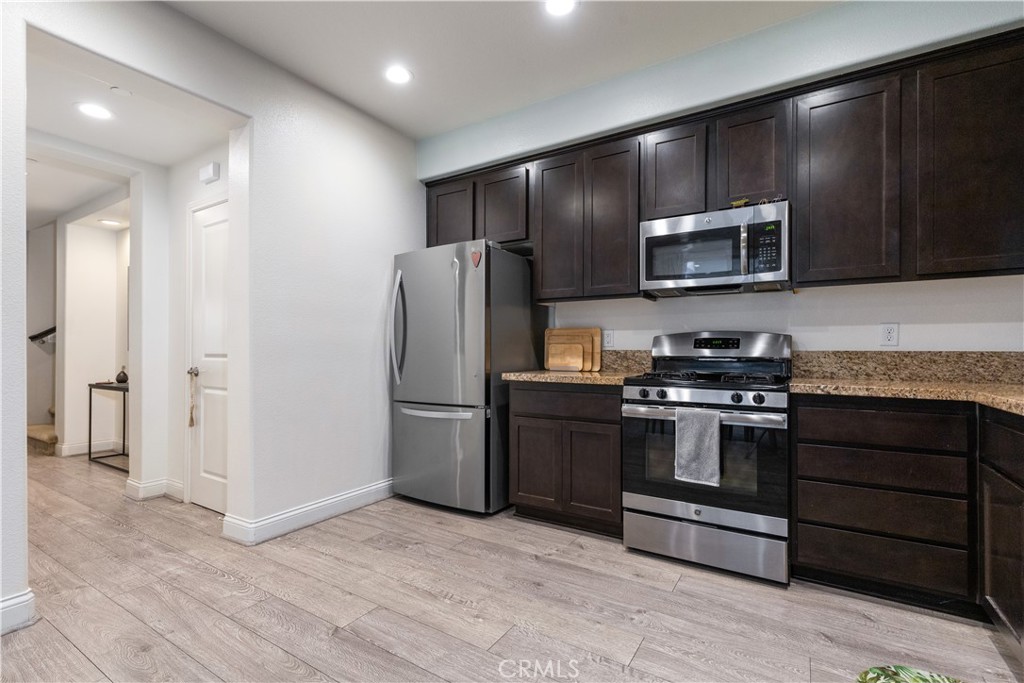 9354 Riberena Circle Atascadero, CA 93422 - Photo 9 of 47 a kitchen with stainless steel appliances granite countertop a refrigerator and a stove top oven