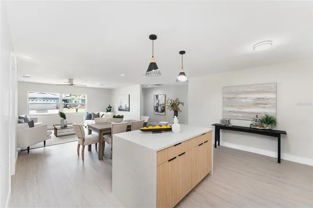 a very nice looking dining room with a table and chairs