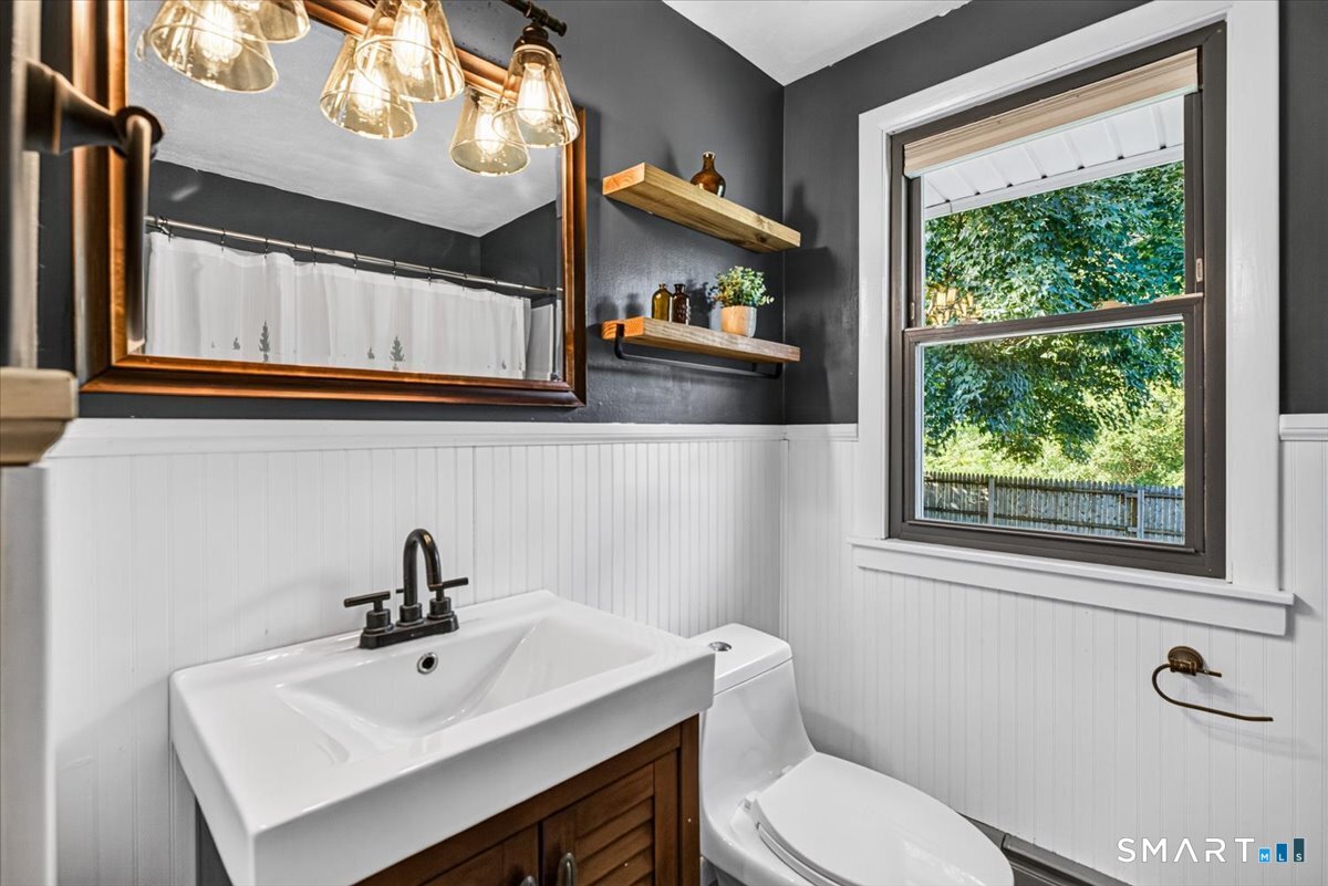121 Hartford Road Simsbury, CT 06070 - Photo 18 of 31 Convenient main-floor full bath featuring a tub and shower combination.