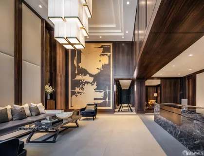 a living room with furniture a window and a chandelier