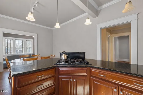 a kitchen with a sink and refrigerator