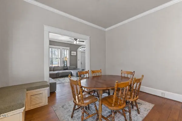 a view of a dining room with furniture and wooden floor