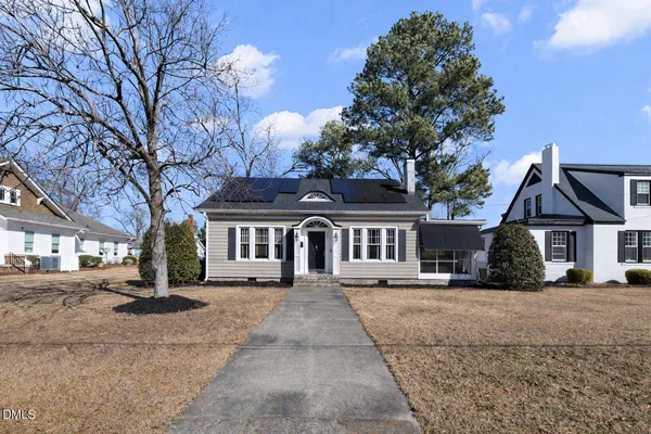 front view of a house with a yard