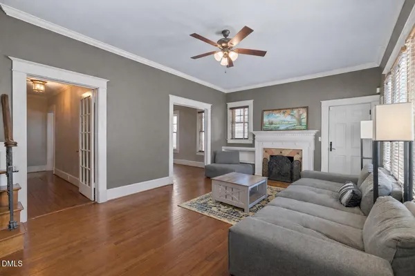 a living room with furniture and a fireplace