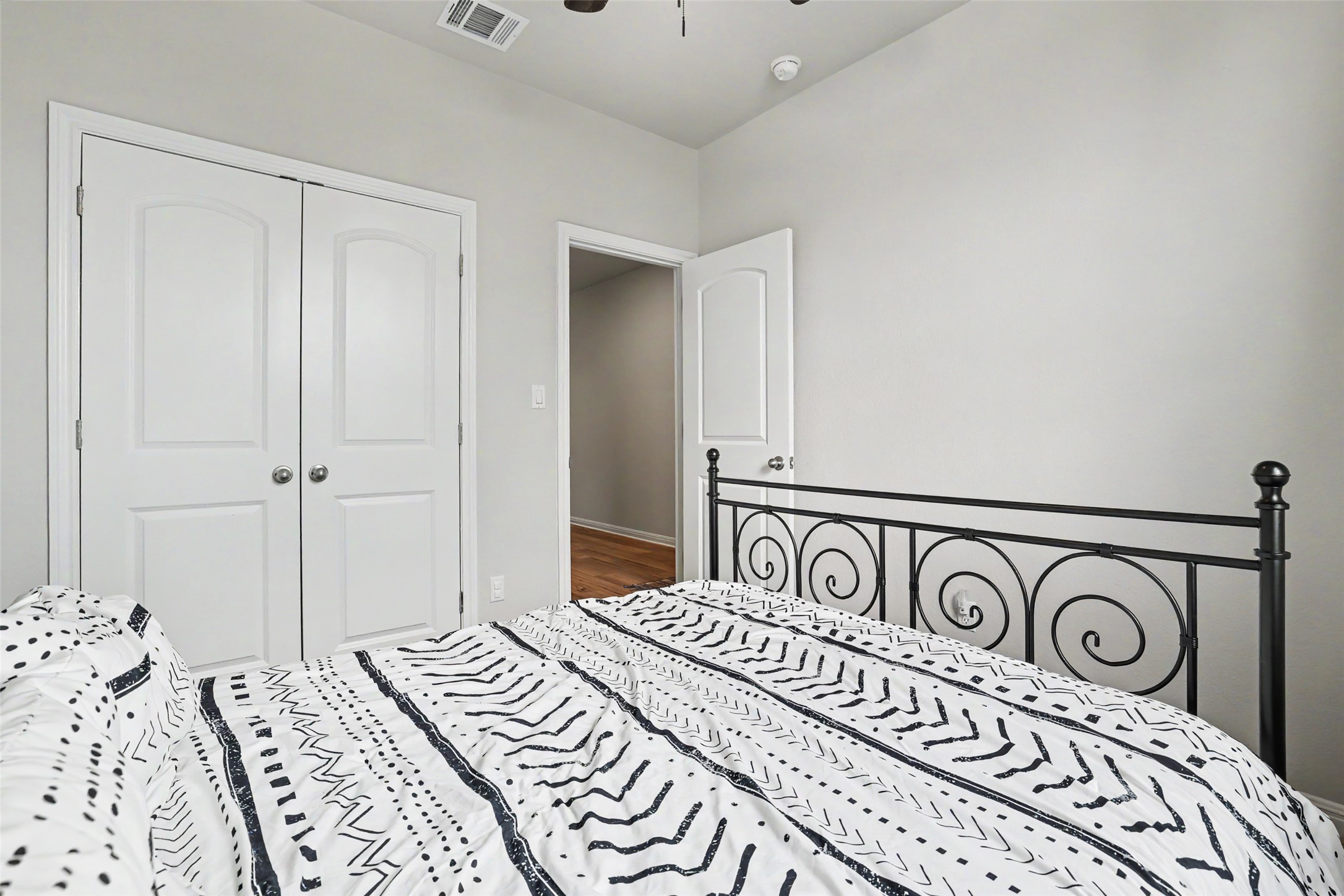 112 Rocking R Court Georgetown, TX 78633 - Photo 29 of 40 Restful bedroom featuring bright walls and warm hardwood flooring.