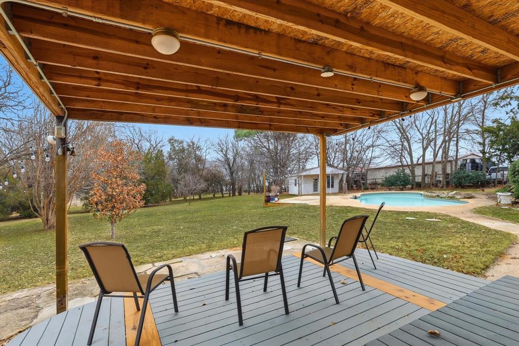 11436 Ridgeview Circle Fort Worth, TX 76244 - Photo 17 of 33 a view of a chairs and table in the patio next to a yard