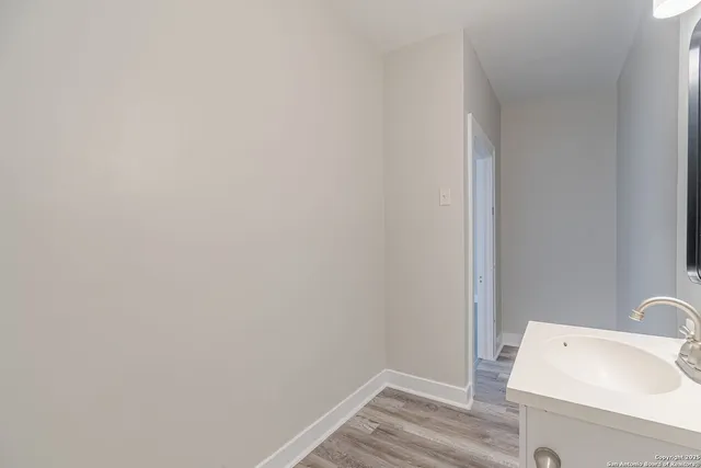 a bathroom with a sink and vanity