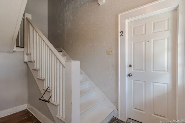 a view of entryway with wooden floor