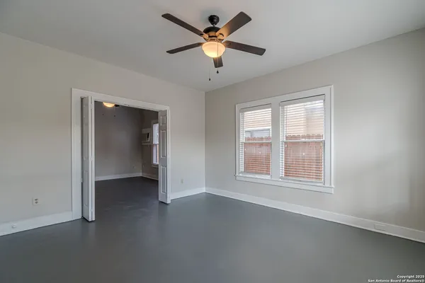 a view of an empty room with a window