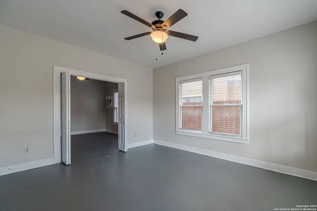 a view of an empty room with a window