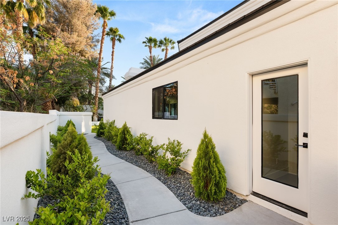 2316 Prometheus Court Henderson, NV 89074 - Photo 61 of 92 View of side of home with fence and stucco siding