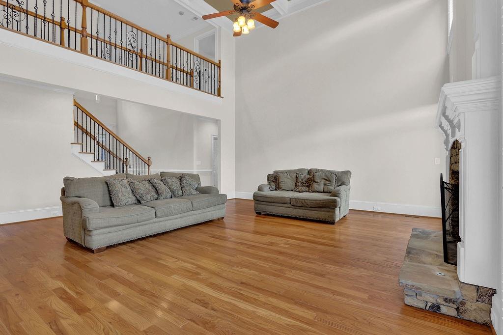 737 Heritage Post Lane Southwest Grayson, GA 30017 - Photo 11 of 50 a living room with furniture and a chandelier