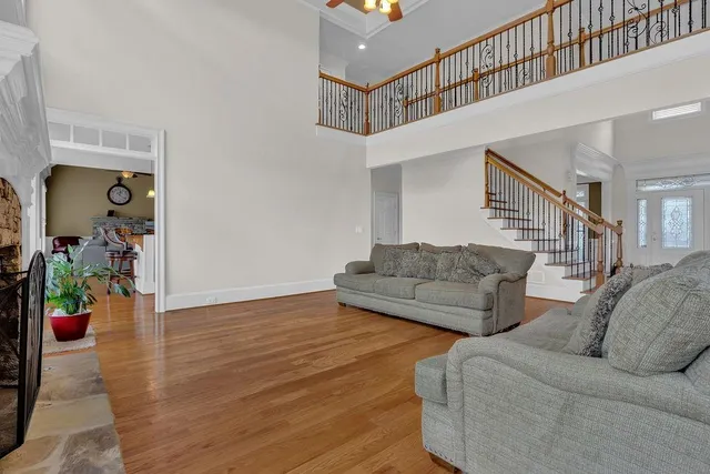 a living room with furniture and wooden floor