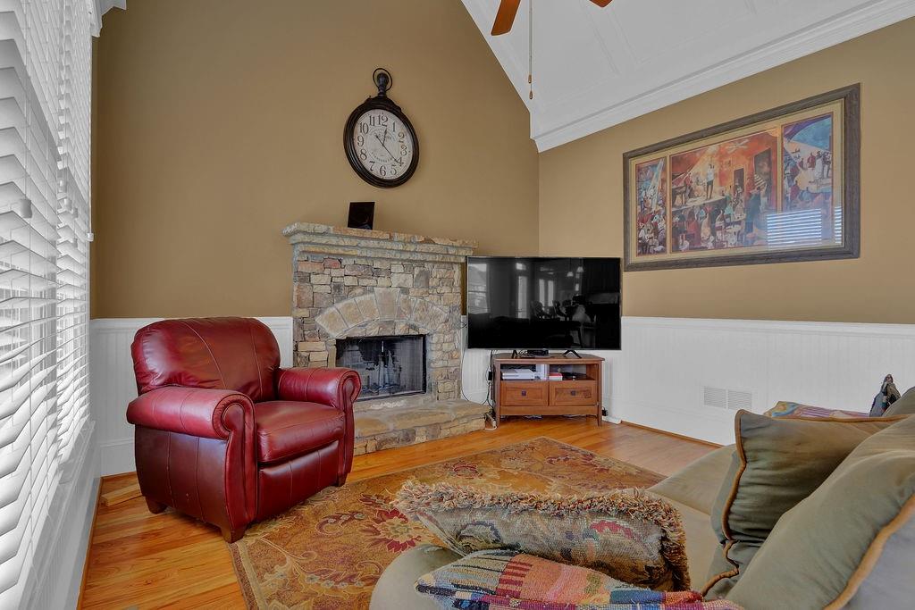 737 Heritage Post Lane Southwest Grayson, GA 30017 - Photo 15 of 50 a living room with furniture a flat screen tv and a wall clock