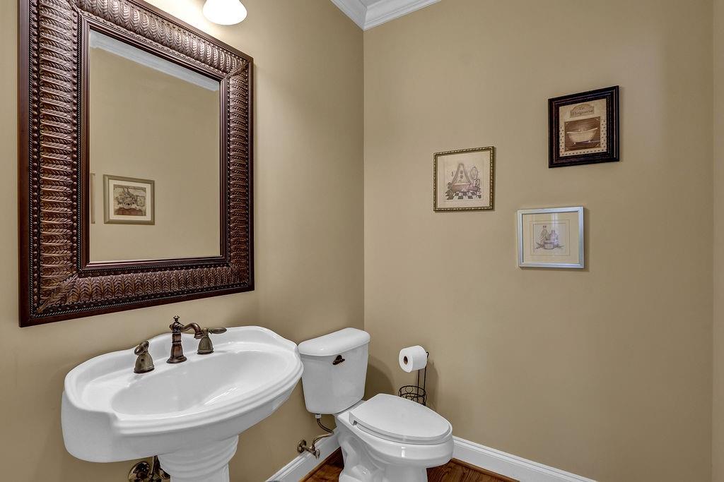 737 Heritage Post Lane Southwest Grayson, GA 30017 - Photo 20 of 50 a bathroom with a toilet sink and mirror