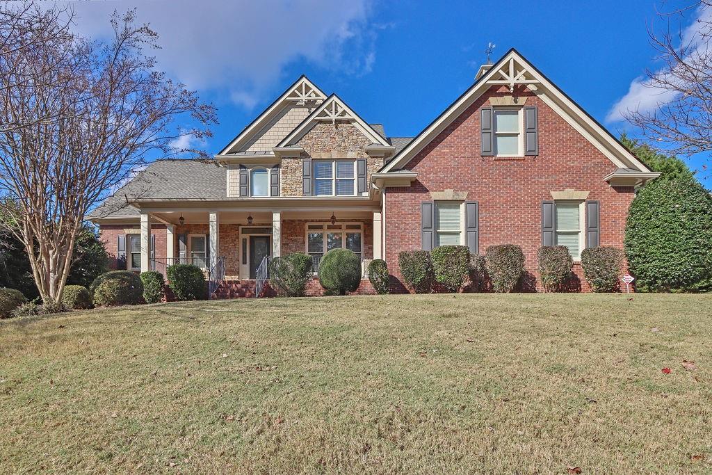 737 Heritage Post Lane Southwest Grayson, GA 30017 - Photo 2 of 50 a front view of a house with a yard
