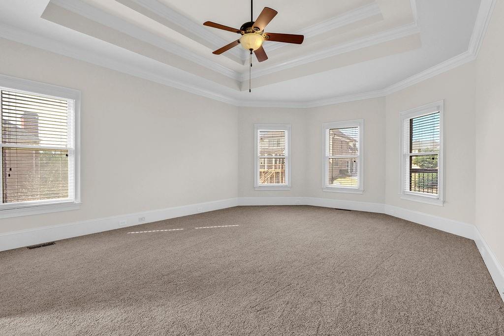 737 Heritage Post Lane Southwest Grayson, GA 30017 - Photo 22 of 50 a view of a room with windows and chandelier fan