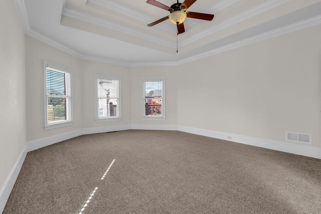737 Heritage Post Lane Southwest Grayson, GA 30017 - Photo 24 of 50 en empty room with windows and ceiling fan view