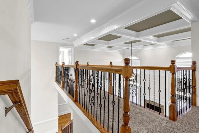 a view of a hallway with stairs