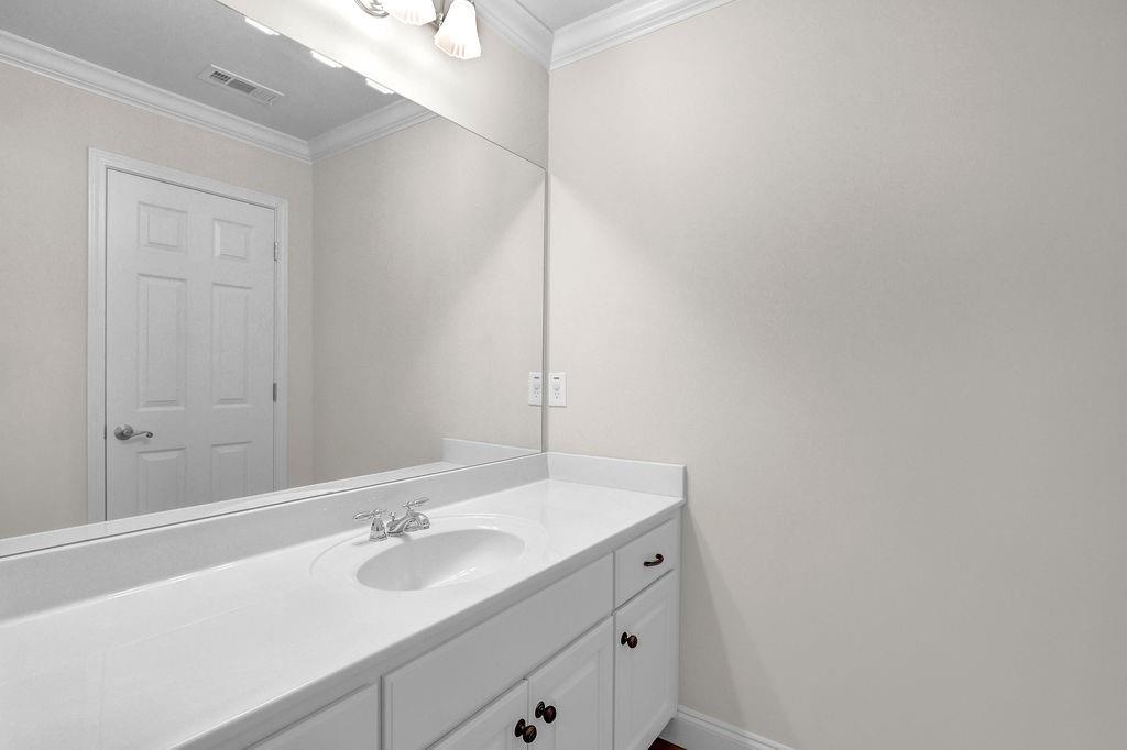 737 Heritage Post Lane Southwest Grayson, GA 30017 - Photo 34 of 50 a bathroom with a sink and a mirror