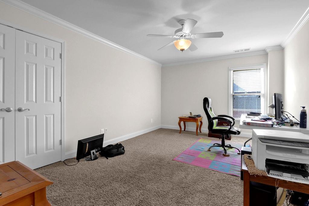 737 Heritage Post Lane Southwest Grayson, GA 30017 - Photo 38 of 50 a living room with furniture and a chandelier