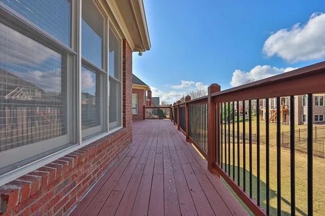 a view of balcony with wooden floor