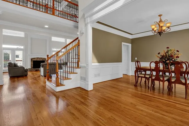 a view of a livingroom with furniture and hardwood floor