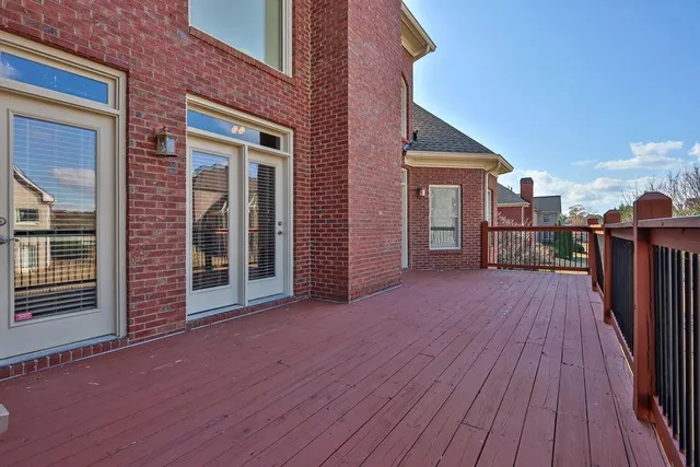 a view of a deck with wooden floor and staircase