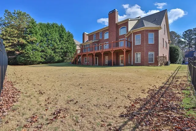 a view of a building with a yard